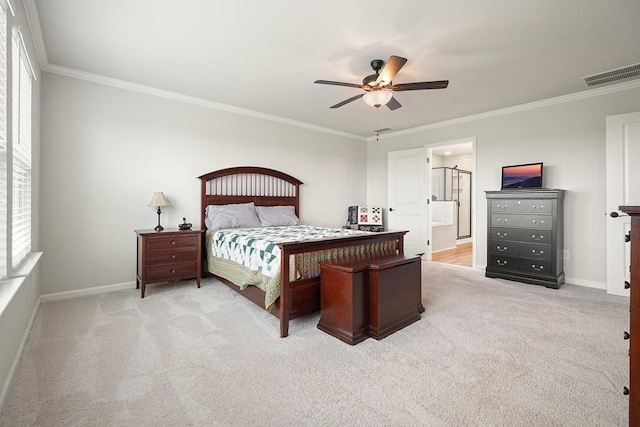 carpeted bedroom with ensuite bathroom, ornamental molding, and ceiling fan