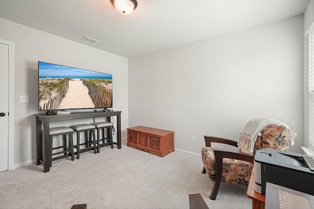 living area with light colored carpet