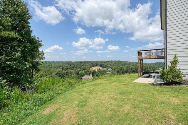 view of yard with a wooden deck