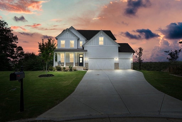 view of front of home featuring a garage and a lawn