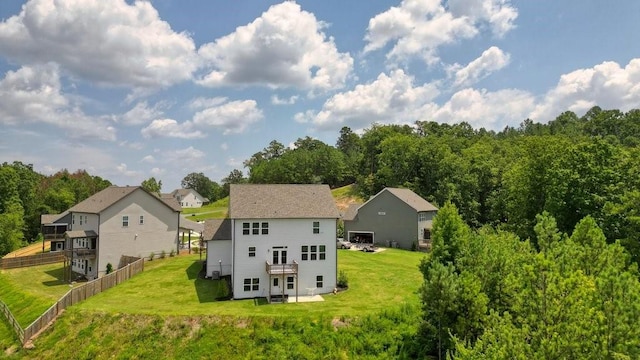 back of property featuring a lawn