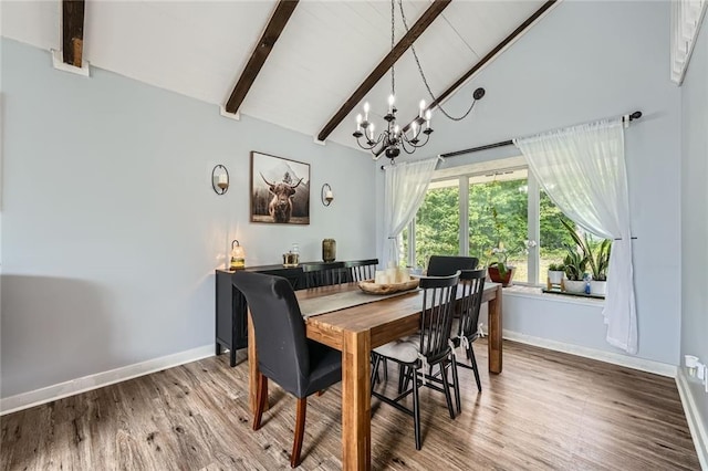 dining room with wood finished floors, baseboards, high vaulted ceiling, beamed ceiling, and a chandelier