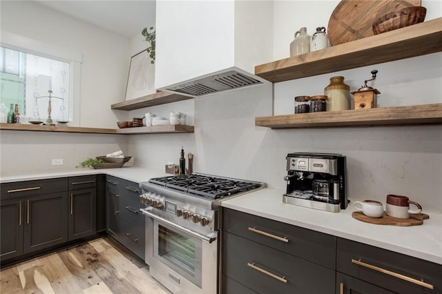 1168 Mado Loop, Chattahoochee Hills, GA 30268 - kitchen featuring open shelves, high end stainless steel range oven, custom exhaust hood, light wood-style floors, and light countertops
