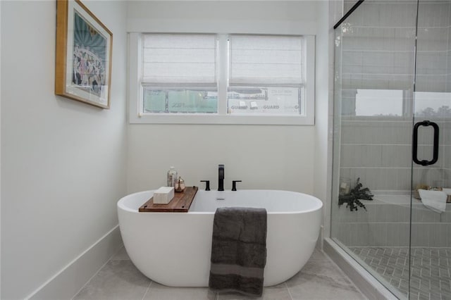1168 Mado Loop, Chattahoochee Hills, GA 30268 - bathroom with healthy amount of natural light, a freestanding bath, and a stall shower