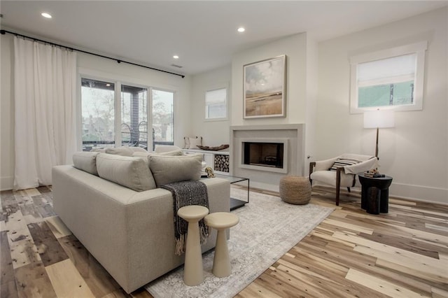 1168 Mado Loop, Chattahoochee Hills, GA 30268 - living room with light wood finished floors, recessed lighting, a fireplace, and baseboards