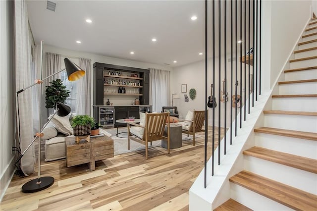 1168 Mado Loop, Chattahoochee Hills, GA 30268 - living area featuring a dry bar, stairs, recessed lighting, light wood finished floors, and wine cooler