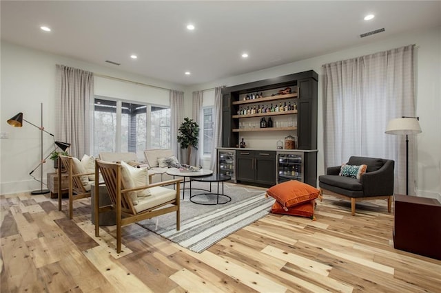 1168 Mado Loop, Chattahoochee Hills, GA 30268 - living room featuring beverage cooler, a dry bar, light wood-type flooring, and recessed lighting
