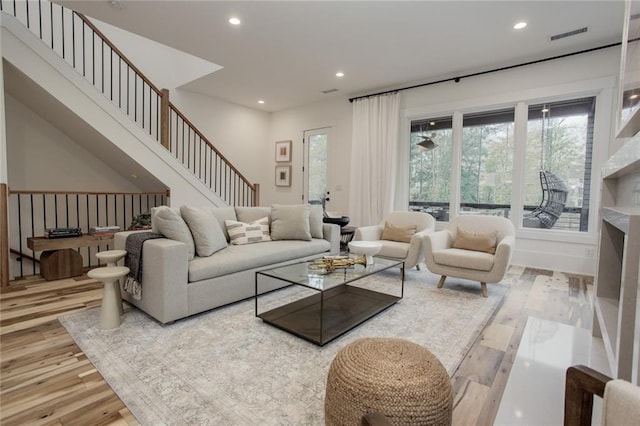1168 Mado Loop, Chattahoochee Hills, GA 30268 - living area featuring wood-type flooring, recessed lighting, and stairway