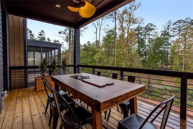 1168 Mado Loop, Chattahoochee Hills, GA 30268 - wooden deck featuring ceiling fan, a sunroom, and outdoor dining space