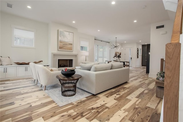 1168 Mado Loop, Chattahoochee Hills, GA 30268 - living room with light wood finished floors, recessed lighting, and a fireplace
