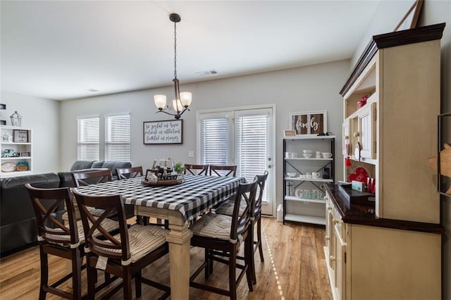 4770 Alford Commons, Cumming, GA 30028 - dining room featuring a chandelier and light wood-style floors