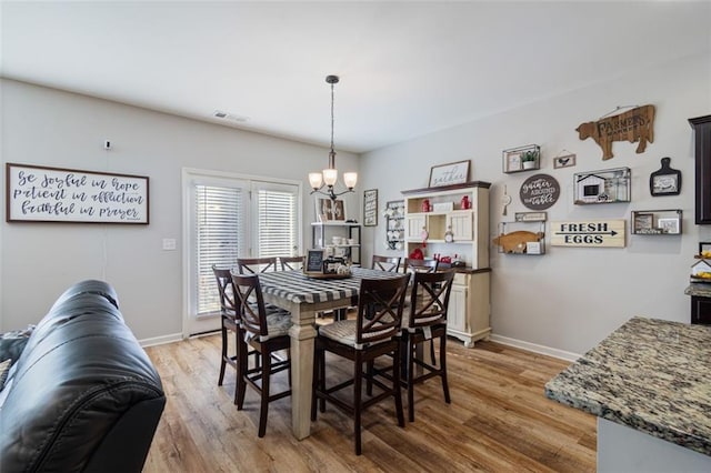 4770 Alford Commons, Cumming, GA 30028 - dining space featuring a chandelier, light wood-style floors, and baseboards