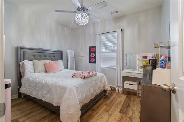 bedroom featuring ceiling fan and light hardwood / wood-style floors