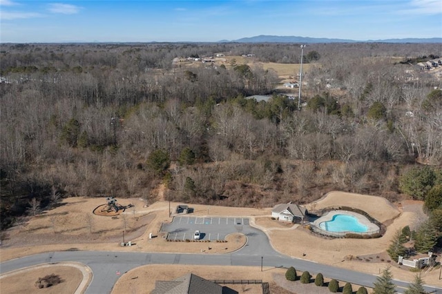 4770 Alford Commons, Cumming, GA 30028 - view of property location with a pool area, mountains, and a heavily wooded area