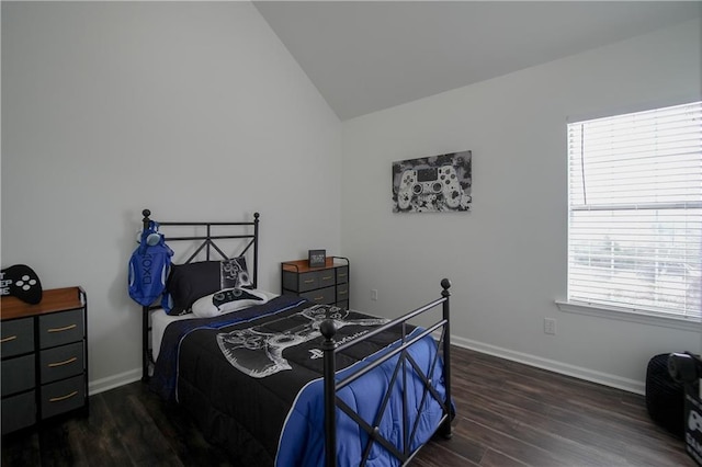 bedroom with lofted ceiling and dark hardwood / wood-style flooring