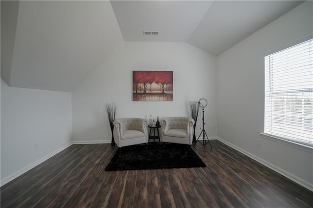 unfurnished room with dark hardwood / wood-style floors and vaulted ceiling