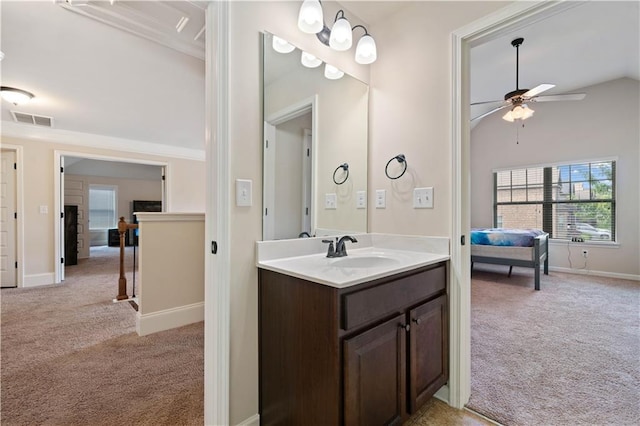 bathroom featuring a ceiling fan, visible vents, vanity, baseboards, and lofted ceiling