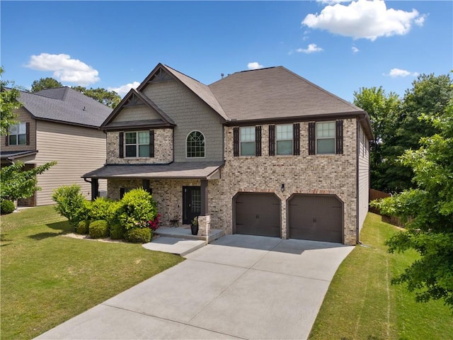 view of front of house featuring an attached garage, driveway, a front lawn, and brick siding