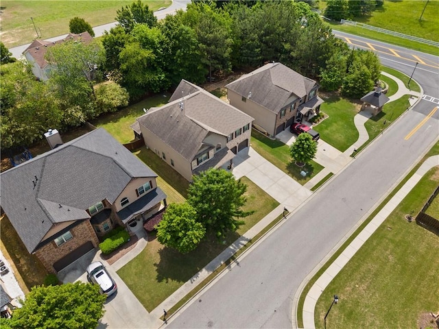birds eye view of property with a residential view