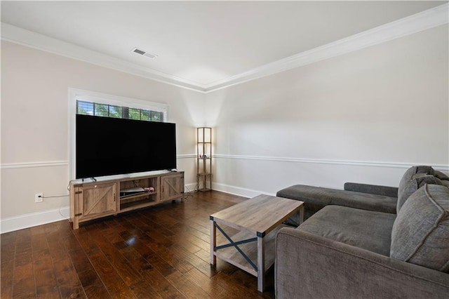 living room featuring baseboards, visible vents, ornamental molding, and hardwood / wood-style flooring