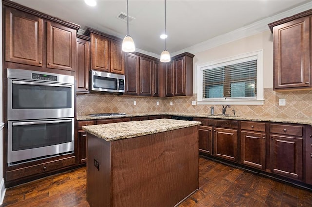 kitchen featuring visible vents, dark brown cabinetry, light stone countertops, a sink, and stainless steel appliances