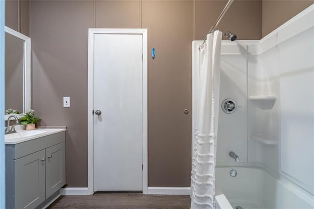 bathroom featuring vanity, shower / bath combo with shower curtain, and hardwood / wood-style flooring