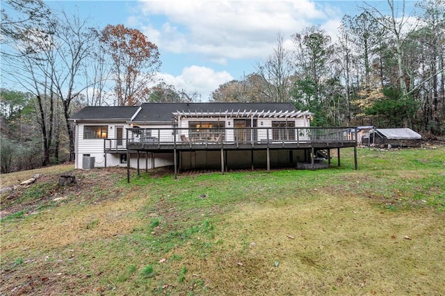 rear view of property with a pergola, a wooden deck, a yard, and cooling unit