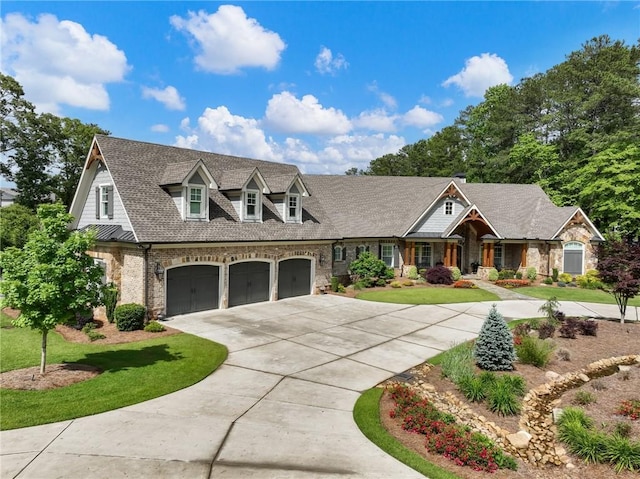 view of front of property with a front yard and a garage