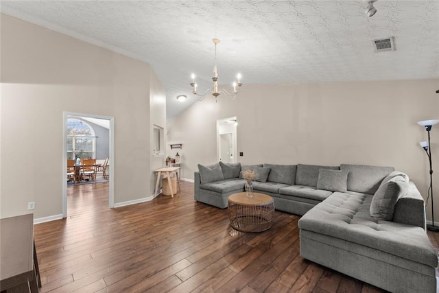 living room with lofted ceiling, a chandelier, dark wood-type flooring, visible vents, and baseboards