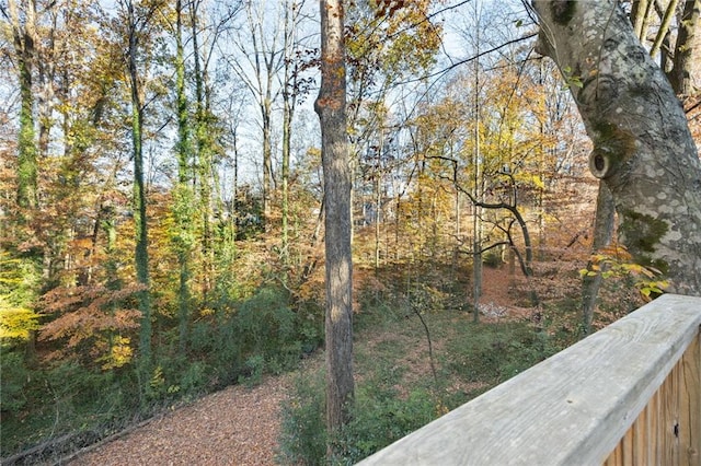 view of yard with a view of trees