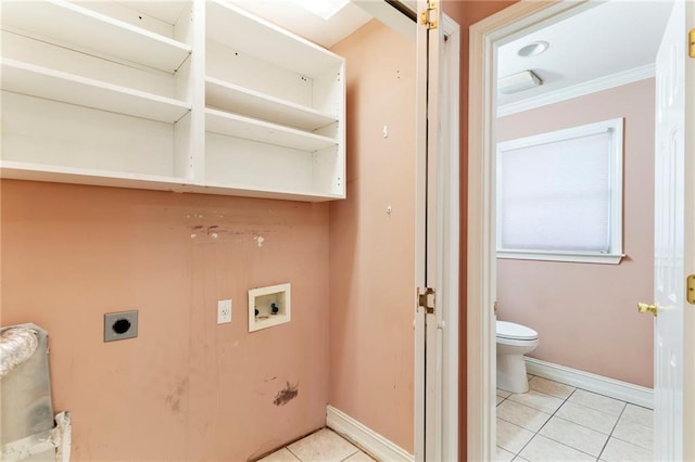 laundry room with light tile patterned floors, laundry area, washer hookup, and electric dryer hookup