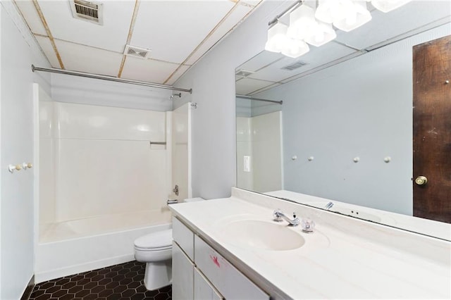 bathroom featuring toilet, visible vents, a drop ceiling, and shower / bathtub combination