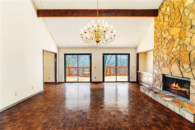 unfurnished living room with high vaulted ceiling, a stone fireplace, beam ceiling, and baseboards