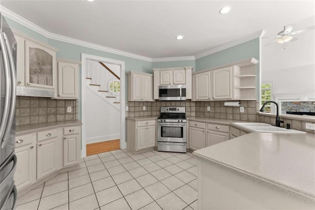 4514 Walking Stick Ln, Gainesville, GA 30506 - kitchen with stainless steel appliances, a sink, open shelves, tasteful backsplash, and light tile patterned flooring