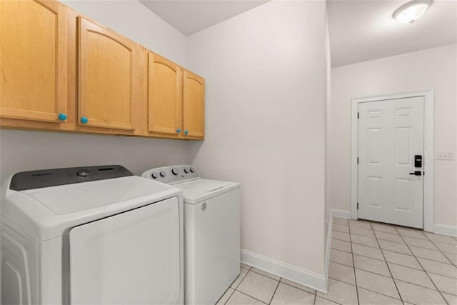 4514 Walking Stick Ln, Gainesville, GA 30506 - laundry room featuring cabinet space, washer and dryer, light tile patterned floors, and baseboards