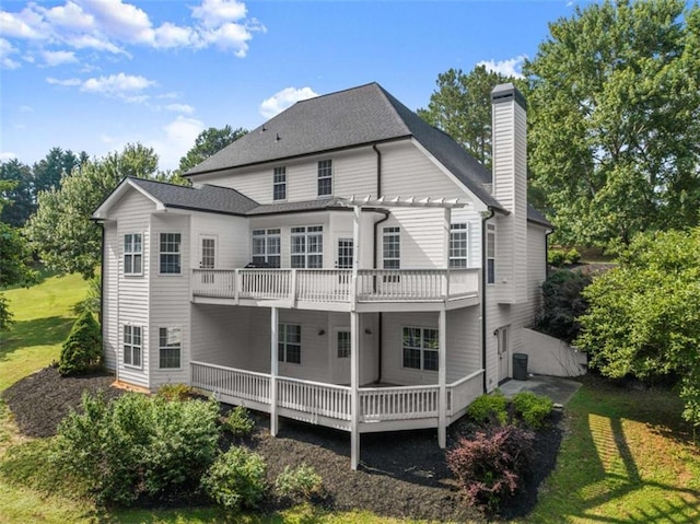 4514 Walking Stick Ln, Gainesville, GA 30506 - rear view of house with a pergola, a chimney, a wooden deck, and a yard