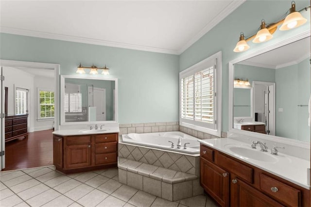 4514 Walking Stick Ln, Gainesville, GA 30506 - full bathroom with two vanities, a garden tub, crown molding, and tile patterned flooring