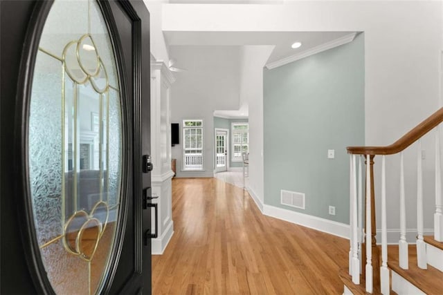 4514 Walking Stick Ln, Gainesville, GA 30506 - entryway with stairs, ornamental molding, light wood-type flooring, and baseboards