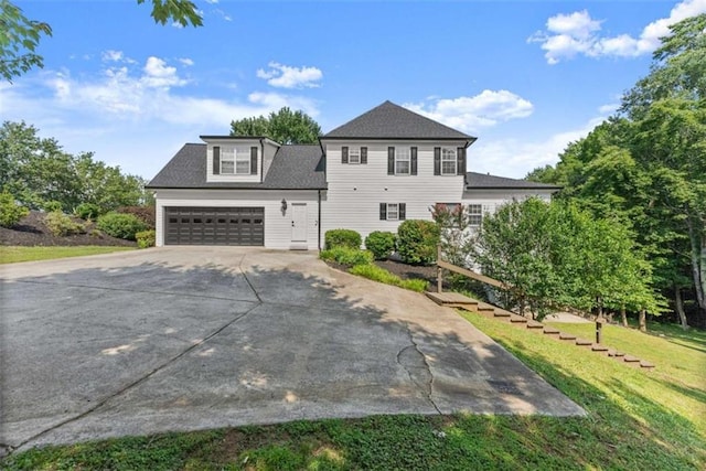 4514 Walking Stick Ln, Gainesville, GA 30506 - view of front of property with concrete driveway, a front yard, an attached garage, and roof with shingles