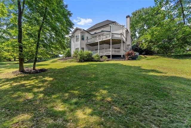 4514 Walking Stick Ln, Gainesville, GA 30506 - rear view of property featuring a chimney, a lawn, and a deck