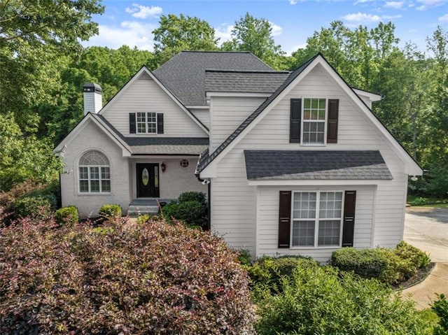 4514 Walking Stick Ln, Gainesville, GA 30506 - traditional-style home with roof with shingles and a chimney