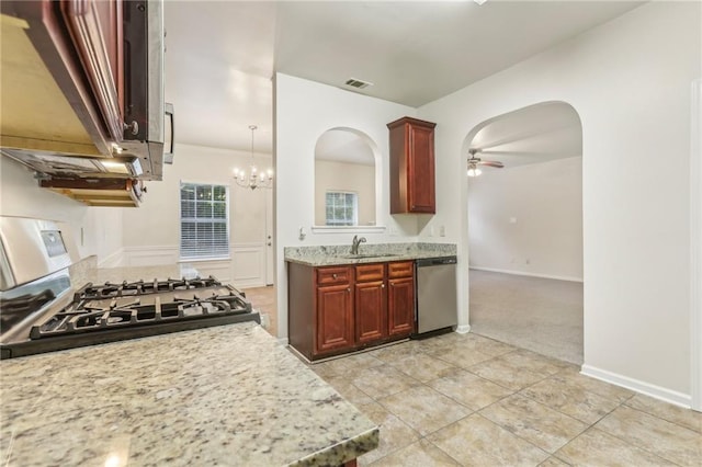 kitchen featuring dishwasher, range with gas stovetop, light carpet, ceiling fan, and light stone counters