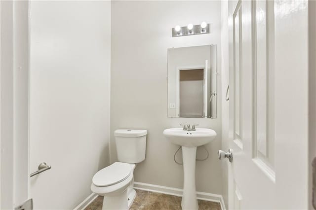 bathroom with sink and toilet