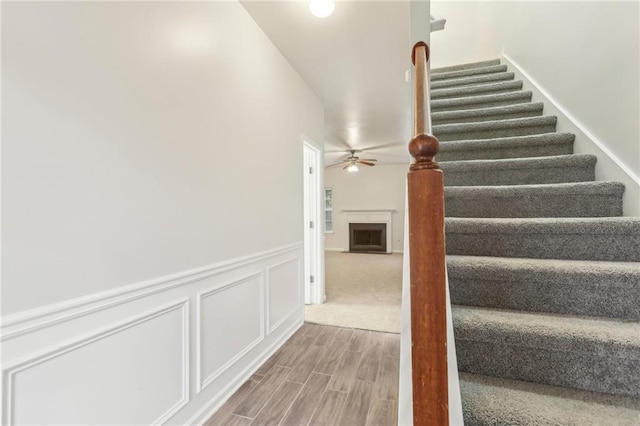 stairway with ceiling fan