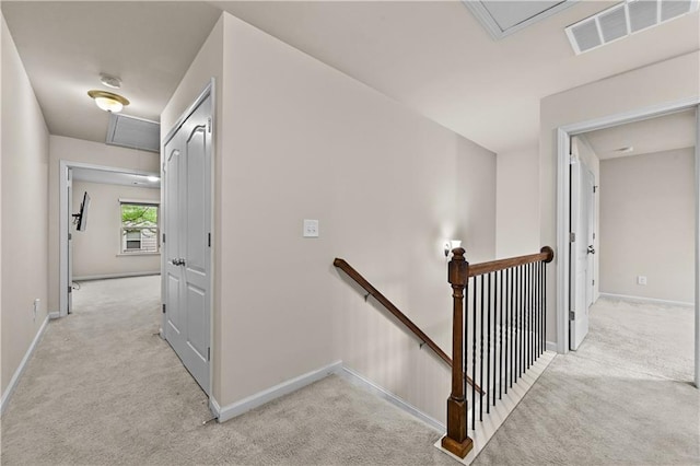 2396 Whiteoak Bnd SE Unit 16, Smyrna, GA 30080 - hallway featuring an upstairs landing, attic access, carpet flooring, and baseboards