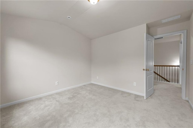 2396 Whiteoak Bnd SE Unit 16, Smyrna, GA 30080 - spare room with lofted ceiling, light carpet, and baseboards