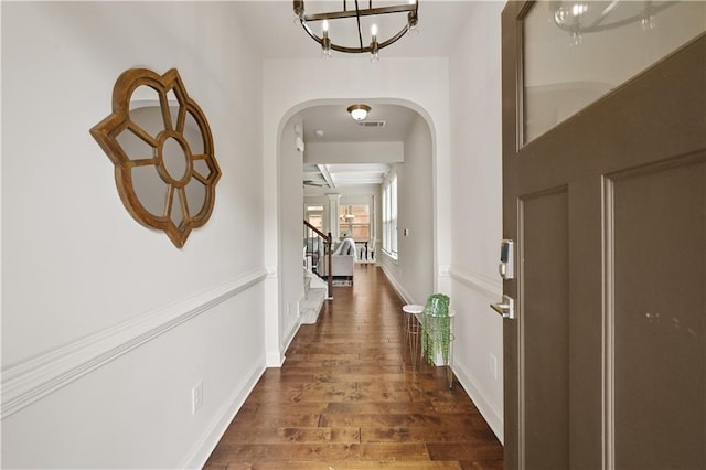 2396 Whiteoak Bnd SE Unit 16, Smyrna, GA 30080 - foyer entrance featuring arched walkways, a chandelier, wood finished floors, stairs, and baseboards