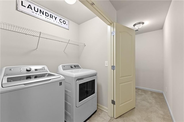 2396 Whiteoak Bnd SE Unit 16, Smyrna, GA 30080 - laundry area with separate washer and dryer, baseboards, and light carpet