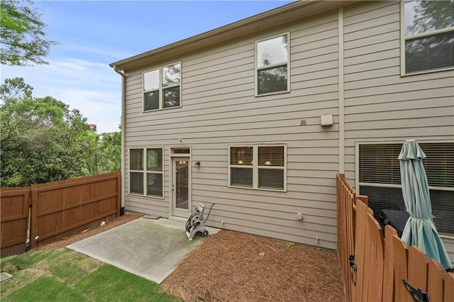 2396 Whiteoak Bnd SE Unit 16, Smyrna, GA 30080 - rear view of property featuring a patio and a fenced backyard