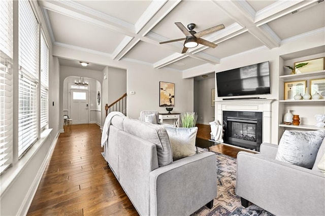 2396 Whiteoak Bnd SE Unit 16, Smyrna, GA 30080 - living area with coffered ceiling, a glass covered fireplace, dark wood-style flooring, beam ceiling, and ceiling fan